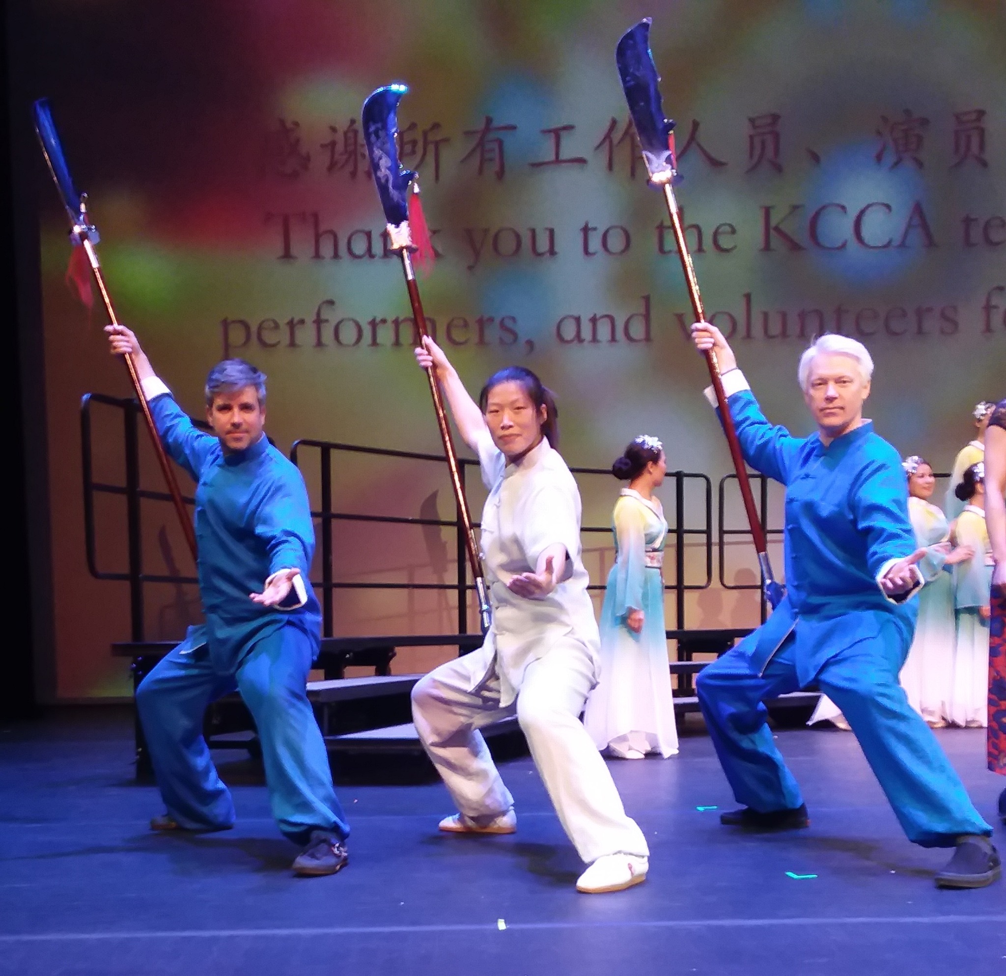 Master Chen Huixian, Aaron Crim, and another academy student posing with Guan Dao weapons