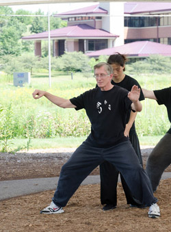 Chen Huixian giving Ken Gullette hands-on corrections for Single Whip at a 2013 workshop